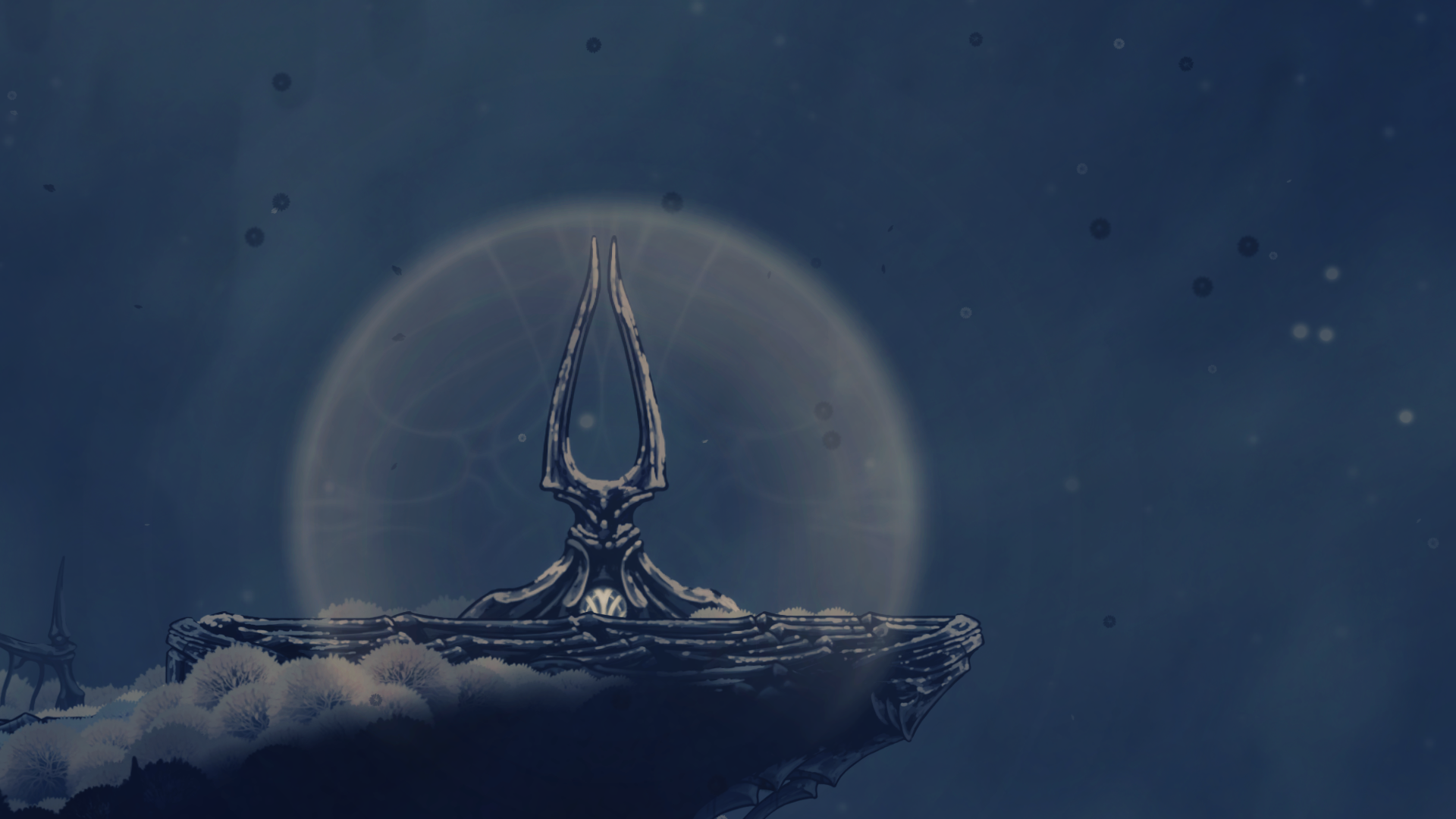 Hornet stands near the summit tuning fork, with open sky beyond the platform.